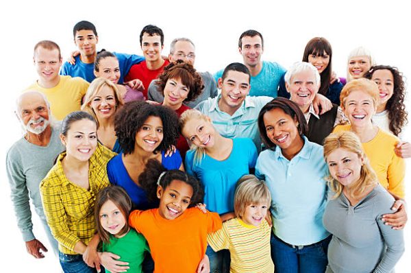 Portrait of a large group of a Mixed Age people smiling and embracing together.